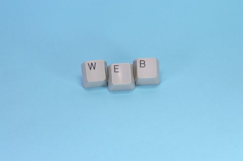 Keyboard keys spell out the word "web."