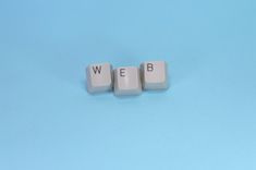 Keyboard keys spell out the word "web."